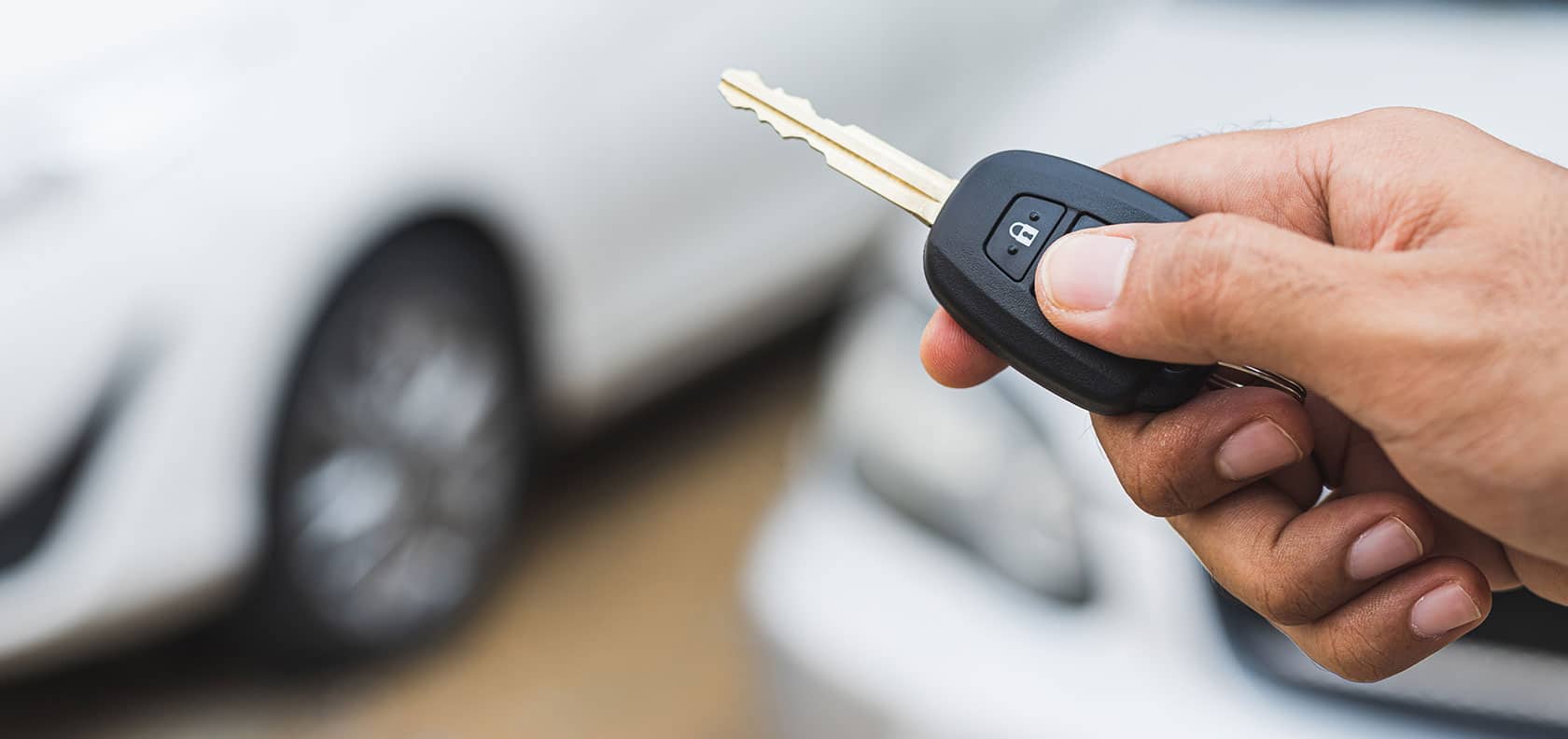 Car key opening a rented car remotely.