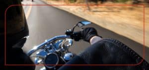 Motorcycle_Blog-Feature Couple with a pet in a rented apartment with furniture and moving boxes.